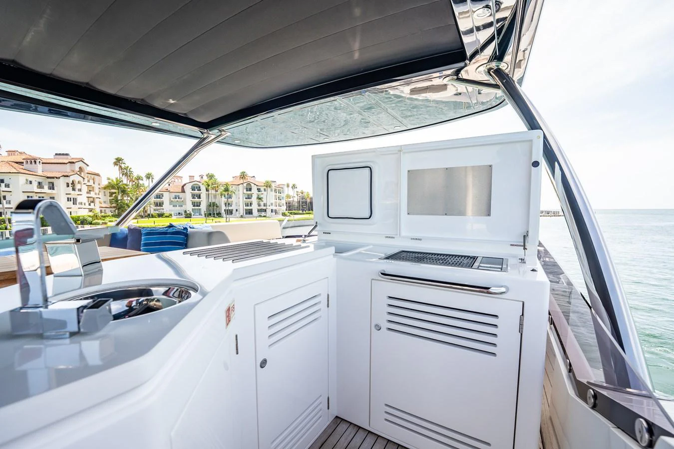 The yacht features a sleek outdoor galley with modern appliances and ample counter space, perfect for alfresco dining. aboard BAZINGA Yacht for Sale