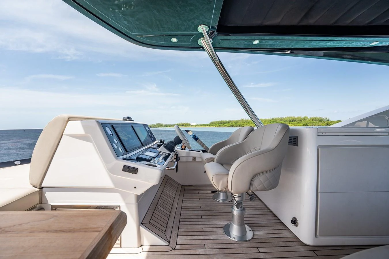 The helm station offers a sleek and modern design with comfortable seating and advanced navigation equipment. aboard BAZINGA Yacht for Sale