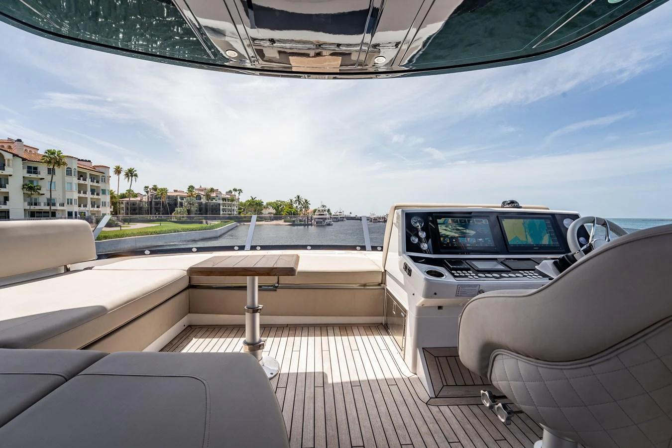 The helm area offers a luxurious and modern space with a stunning view of the water and surrounding scenery. aboard BAZINGA Yacht for Sale