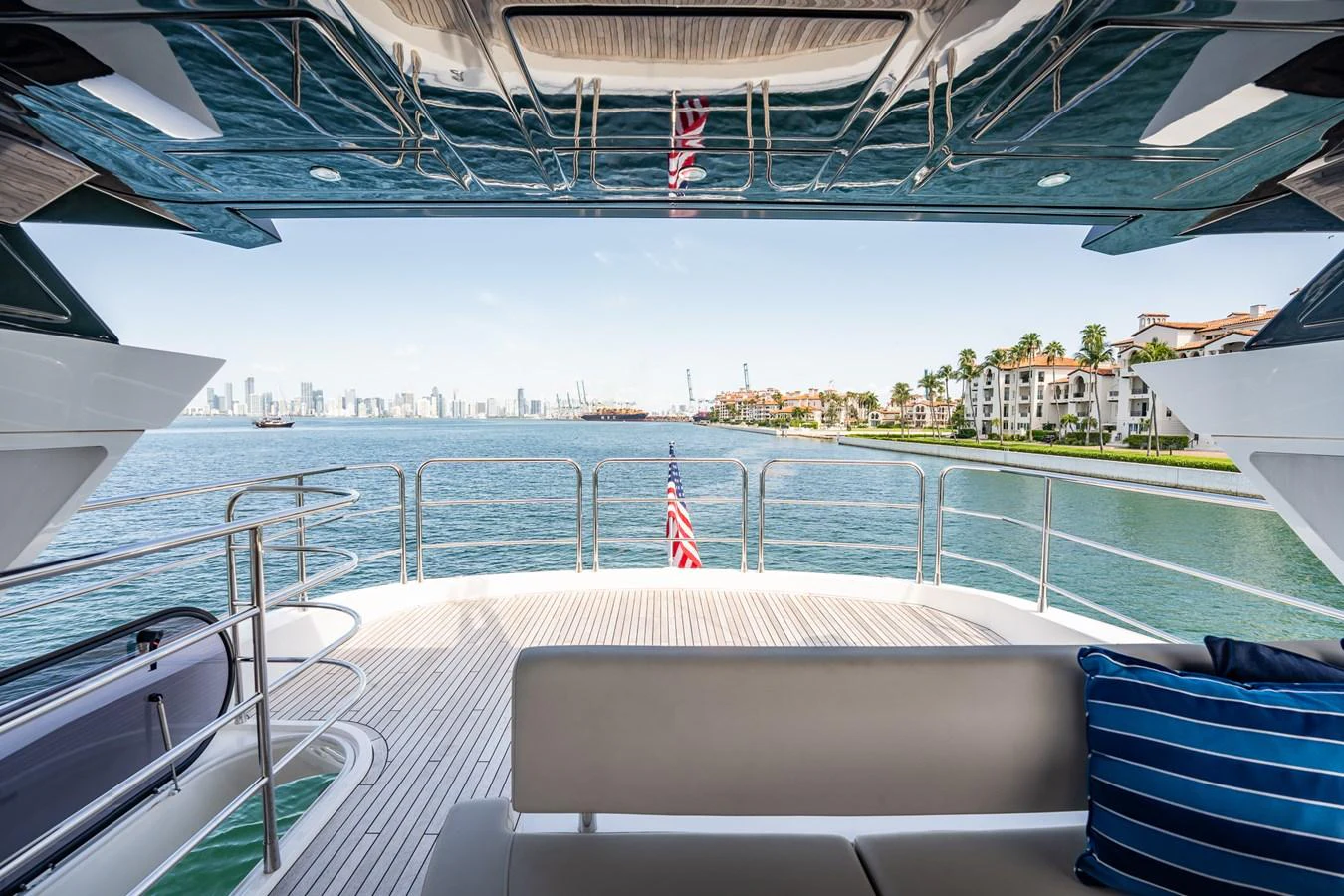 The aft deck offers a stunning view of the water and city skyline, perfect for relaxation and entertaining. aboard BAZINGA Yacht for Sale