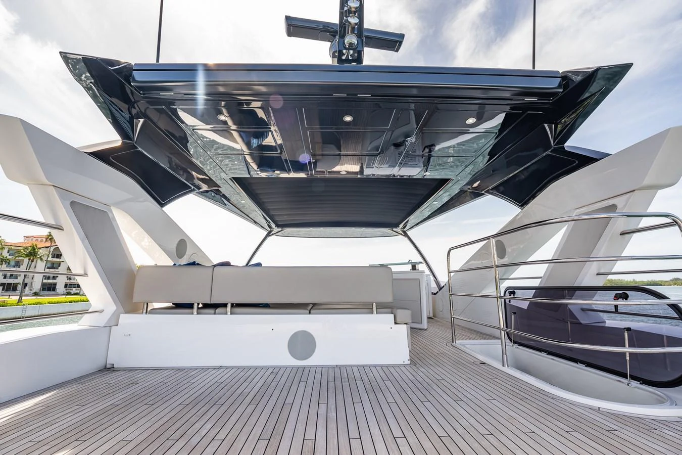 The spacious aft deck features comfortable seating and a sleek, modern design. aboard BAZINGA Yacht for Sale