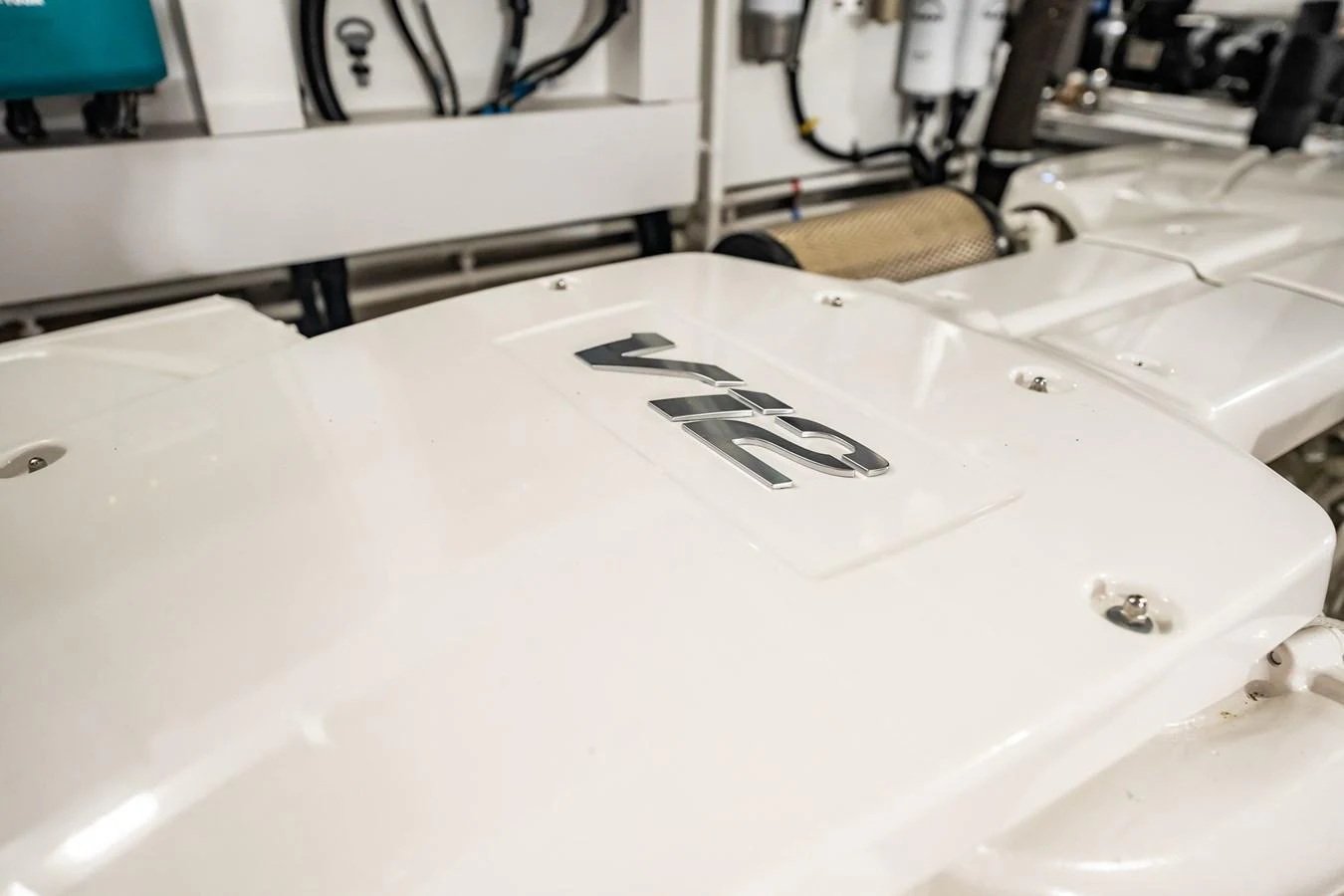 A close-up view of a powerful V12 engine component in the yacht's engine room. aboard BAZINGA Yacht for Sale