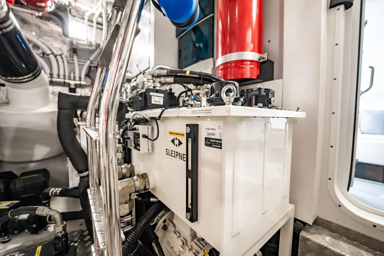A detailed view of the yacht's engine room showcasing its advanced machinery and equipment. aboard BAZINGA Yacht for Sale