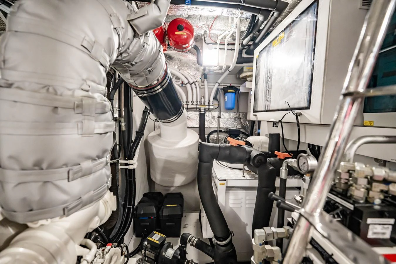 The image showcases the intricate and well-maintained engine room of the yacht. aboard BAZINGA Yacht for Sale