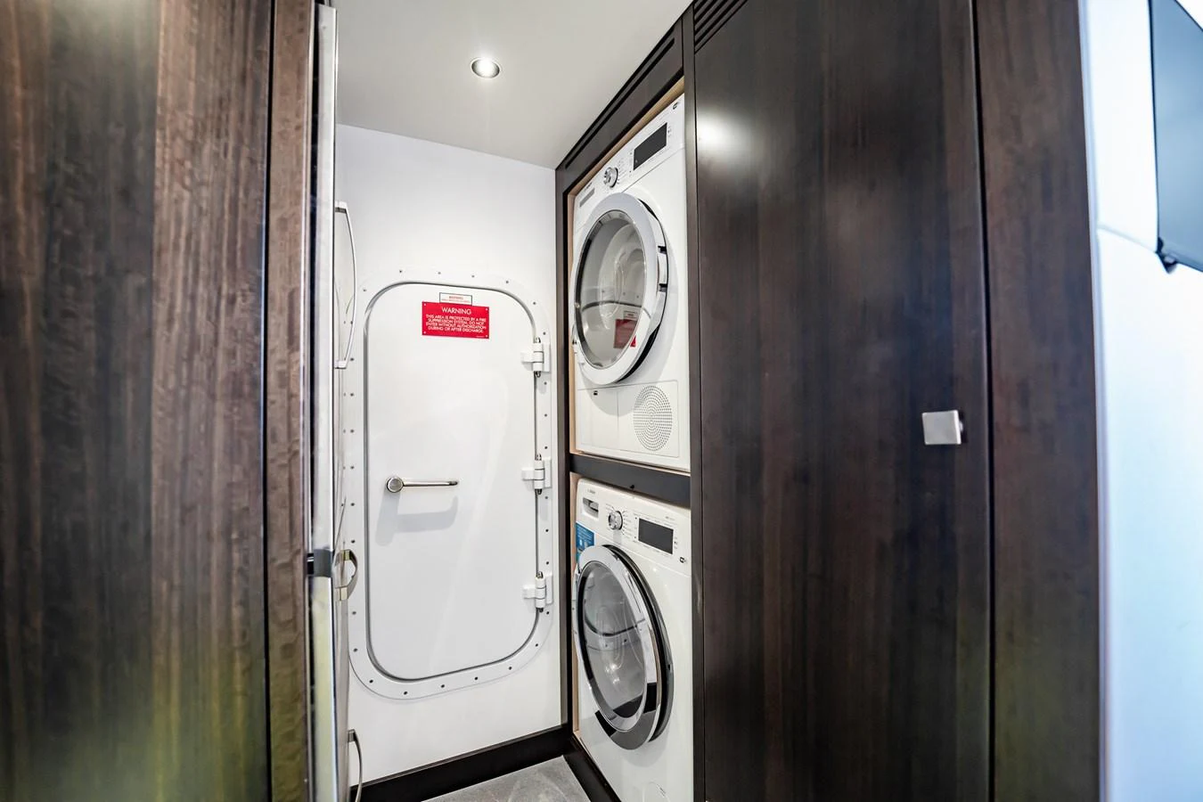 The yacht's laundry room is equipped with modern appliances and ample storage space. aboard BAZINGA Yacht for Sale