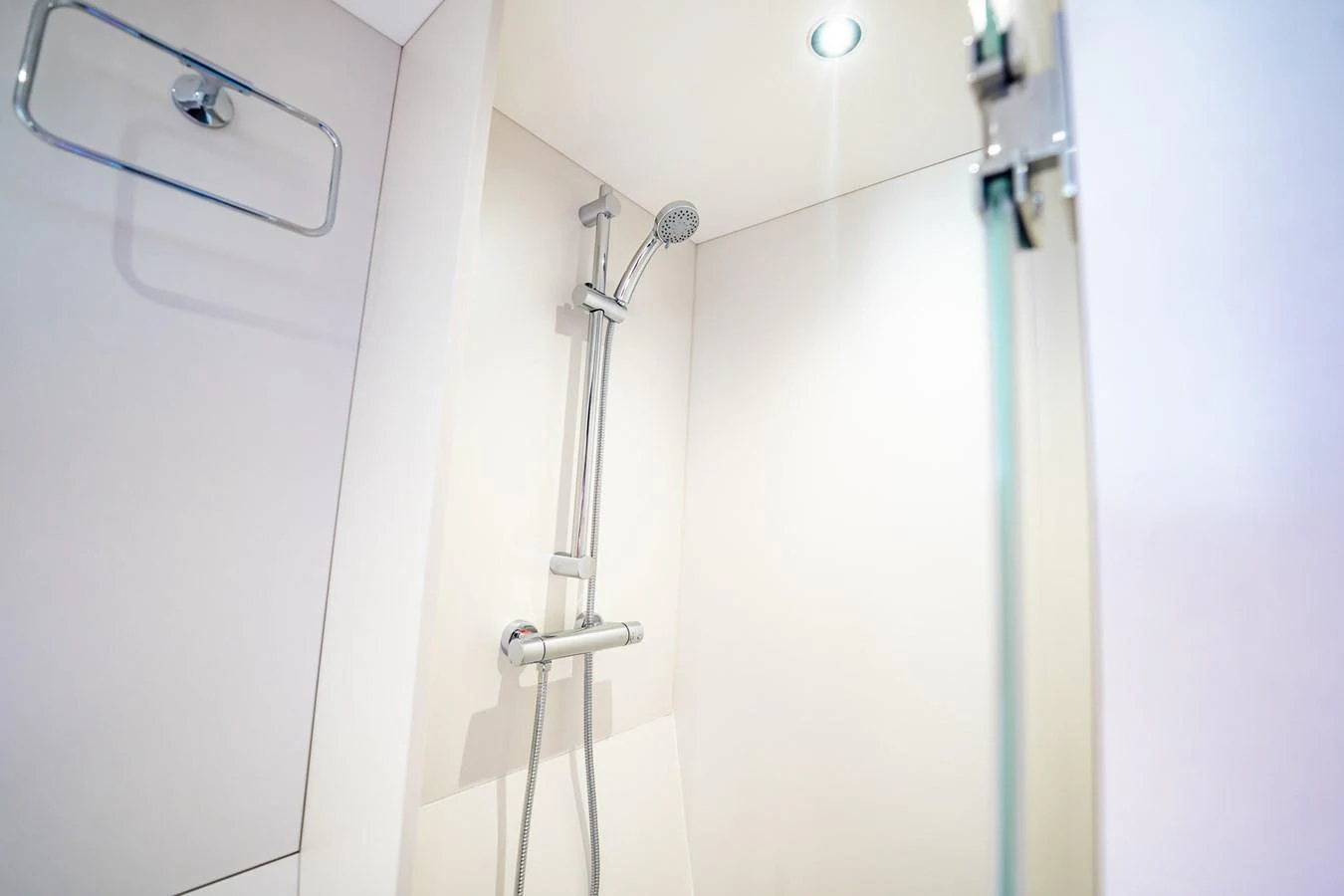 A sleek and modern shower area with a minimalist design. aboard BAZINGA Yacht for Sale