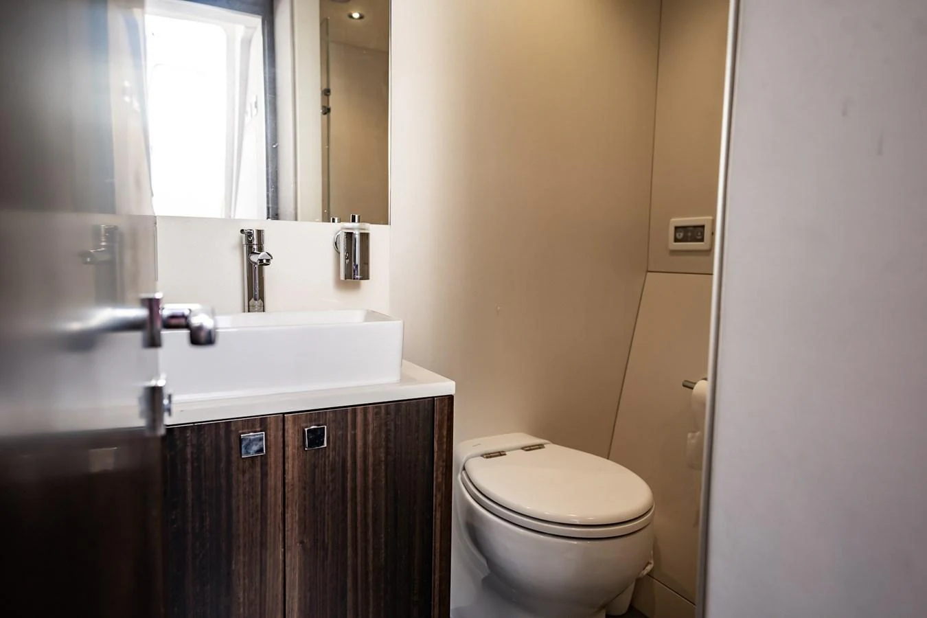 A modern yacht bathroom with a sleek design and contemporary fixtures. aboard BAZINGA Yacht for Sale