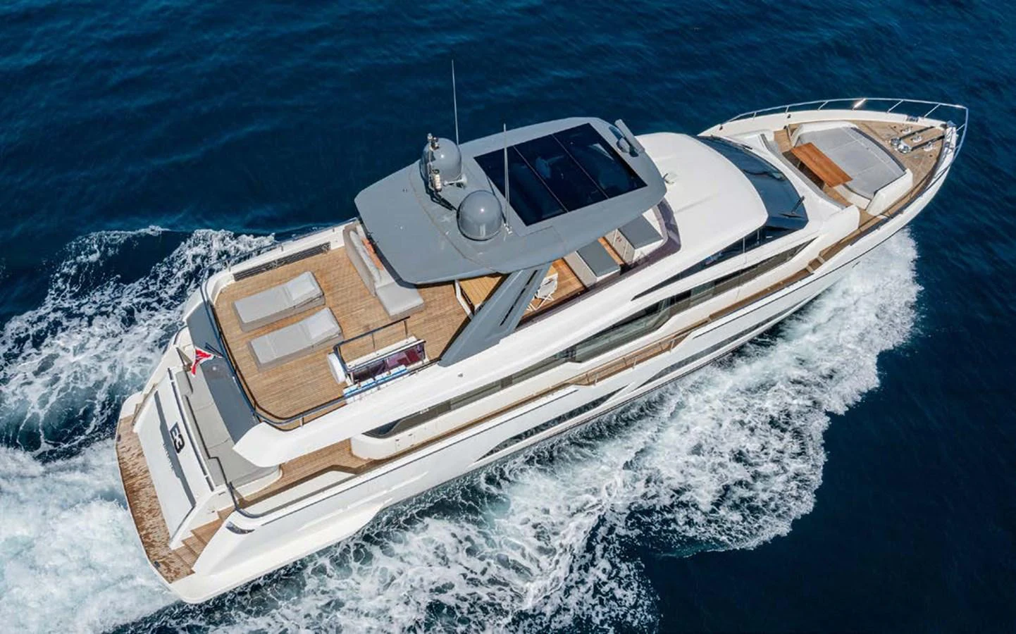 This sleek yacht glides effortlessly through the water, showcasing its modern design and spacious decks. aboard E3 Yacht for Sale