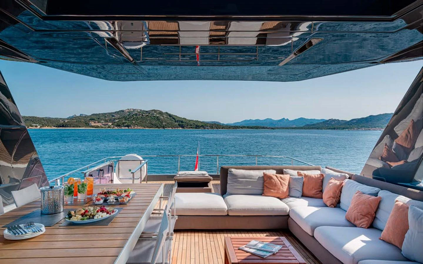 The aft deck offers a luxurious outdoor lounging and dining area with stunning sea views. aboard E3 Yacht for Sale