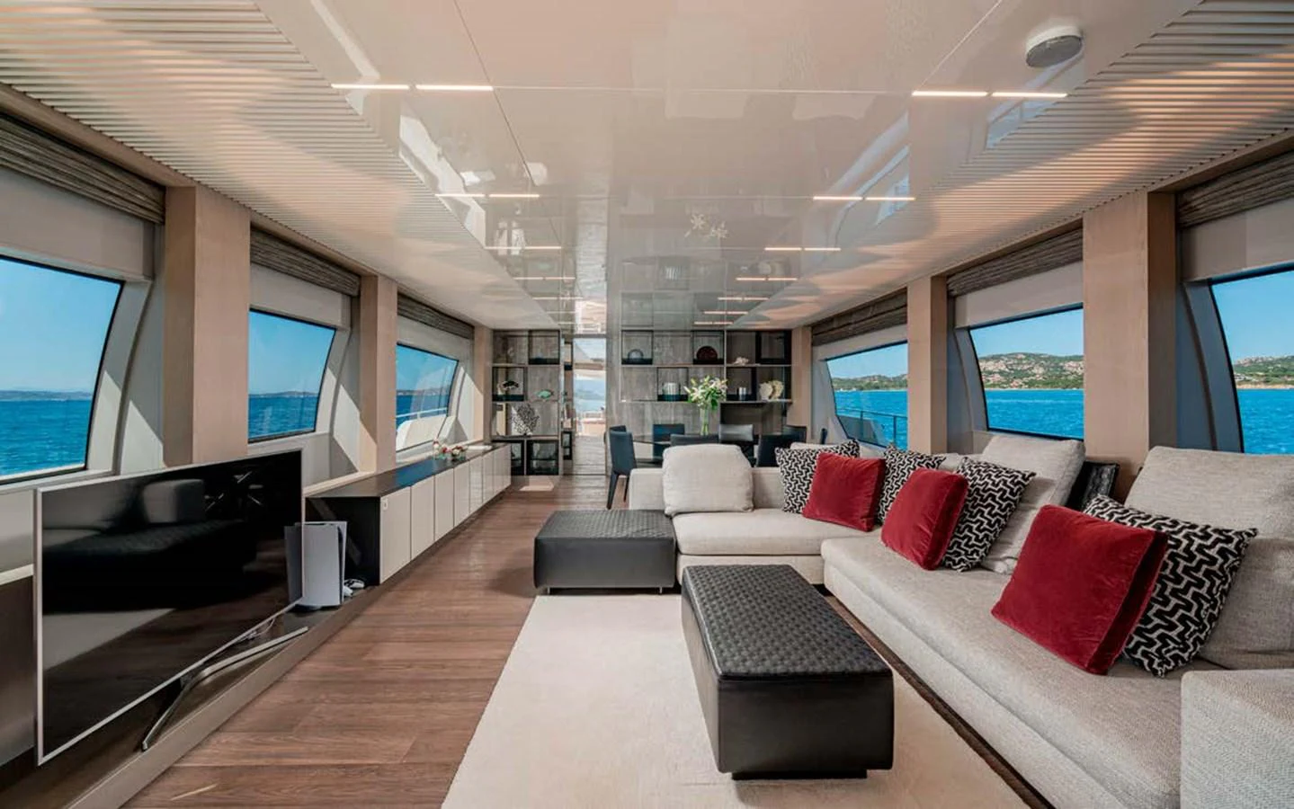 The yacht's salon features a spacious and modern design with large windows offering stunning ocean views. aboard E3 Yacht for Sale