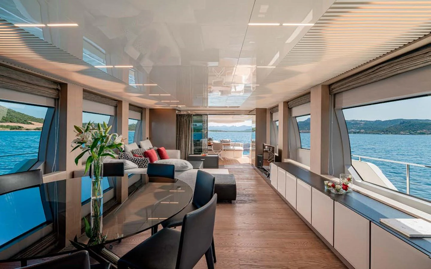 The salon offers a spacious and elegant area with panoramic views and luxurious furnishings. aboard E3 Yacht for Sale