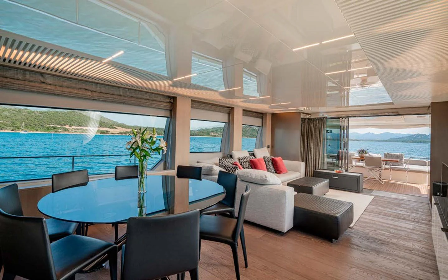 The salon offers a spacious and luxurious setting with panoramic views and elegant furnishings. aboard E3 Yacht for Sale