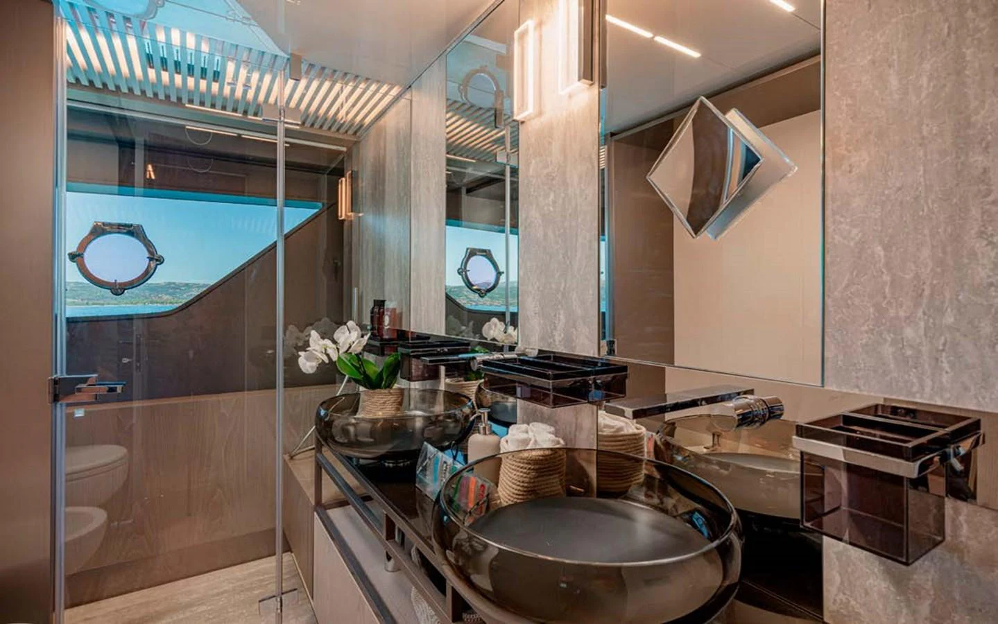 The yacht's bathroom features modern fixtures and a sleek design with ample lighting. aboard E3 Yacht for Sale