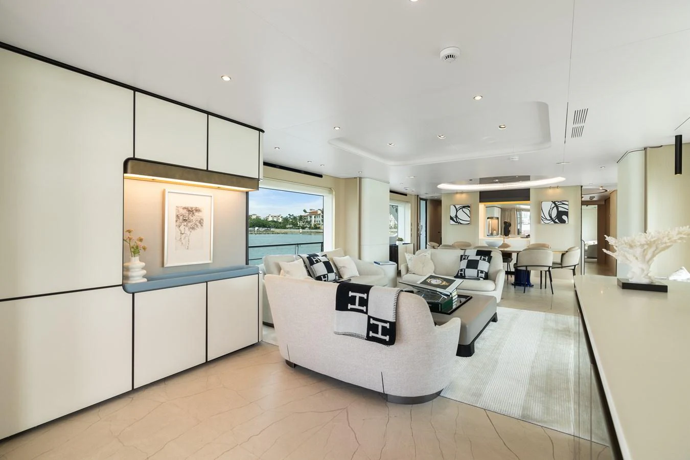 The salon offers a spacious and elegantly designed living area with modern furnishings and ample natural light. aboard AZIMUT GRANDE 32/23 Yacht for Sale