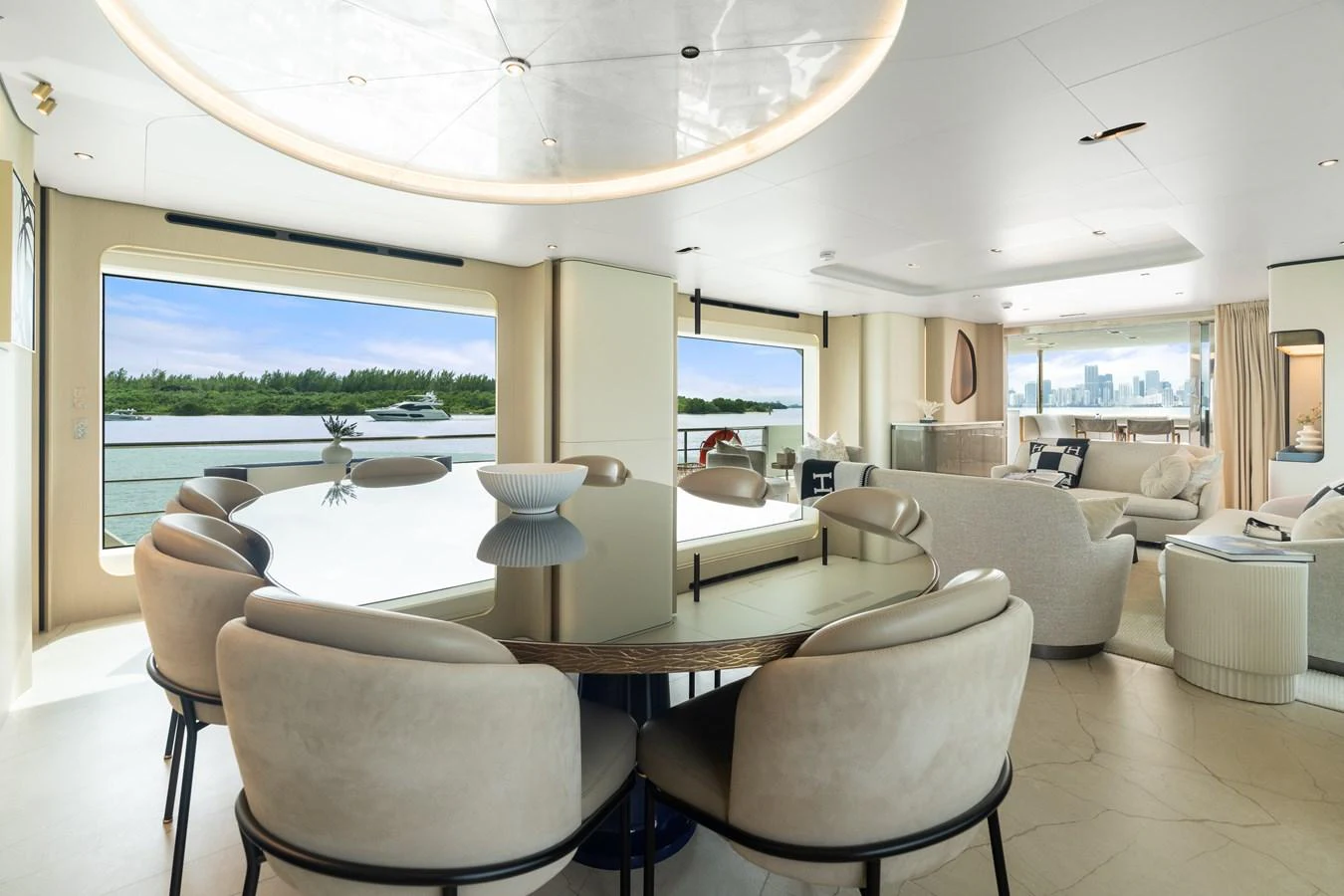 The salon features elegant seating and dining areas with large windows offering stunning views. aboard AZIMUT GRANDE 32/23 Yacht for Sale