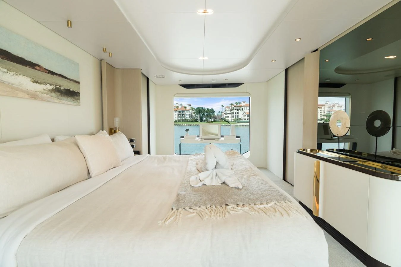 The master stateroom offers a luxurious and serene retreat with a stunning view of the water. aboard AZIMUT GRANDE 32/23 Yacht for Sale
