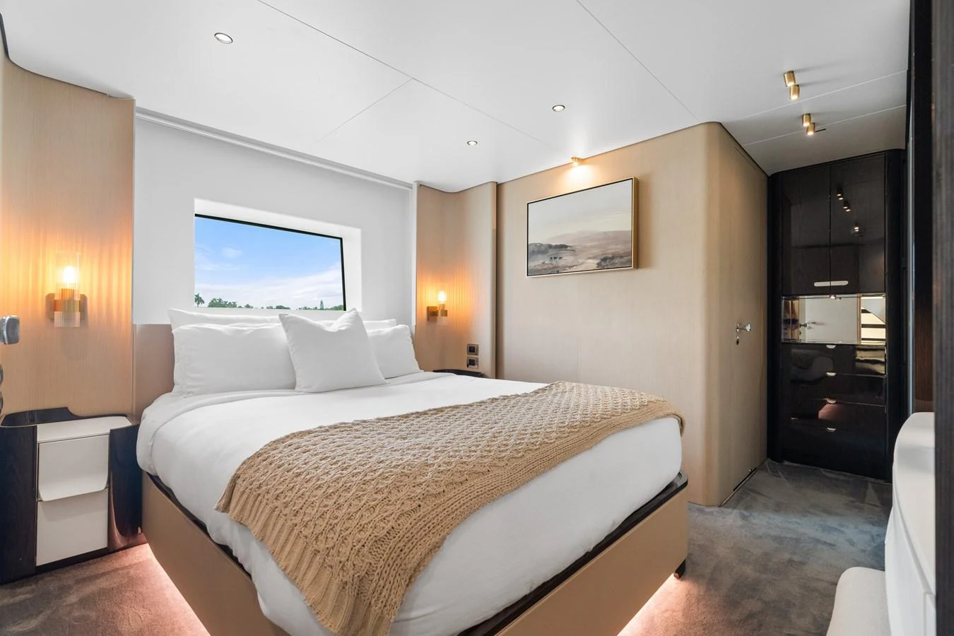 A luxurious stateroom featuring a large bed with elegant bedding and modern lighting. aboard AZIMUT GRANDE 32/23 Yacht for Sale