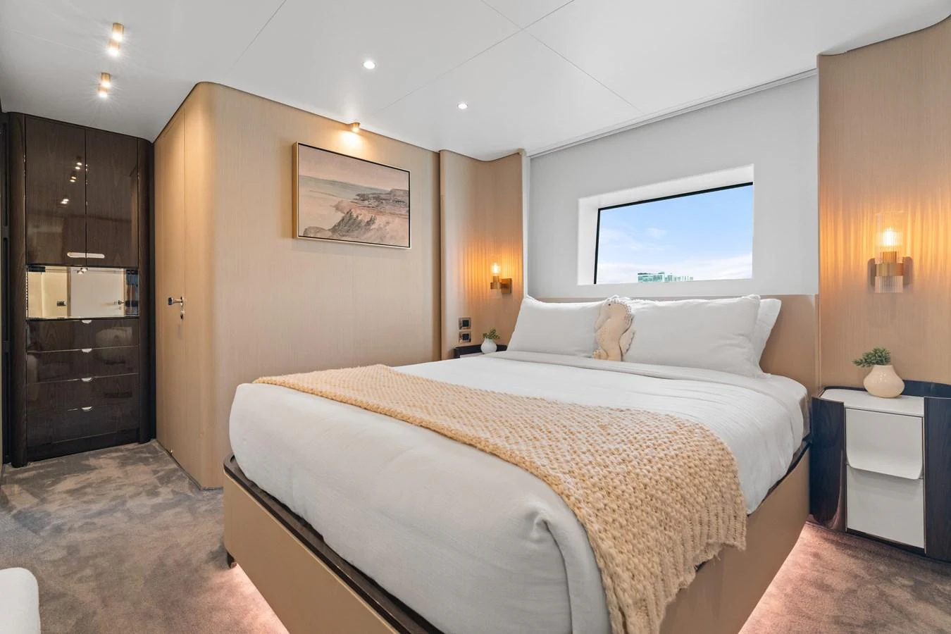 The stateroom features a plush bed with elegant decor and ample natural light. aboard AZIMUT GRANDE 32/23 Yacht for Sale