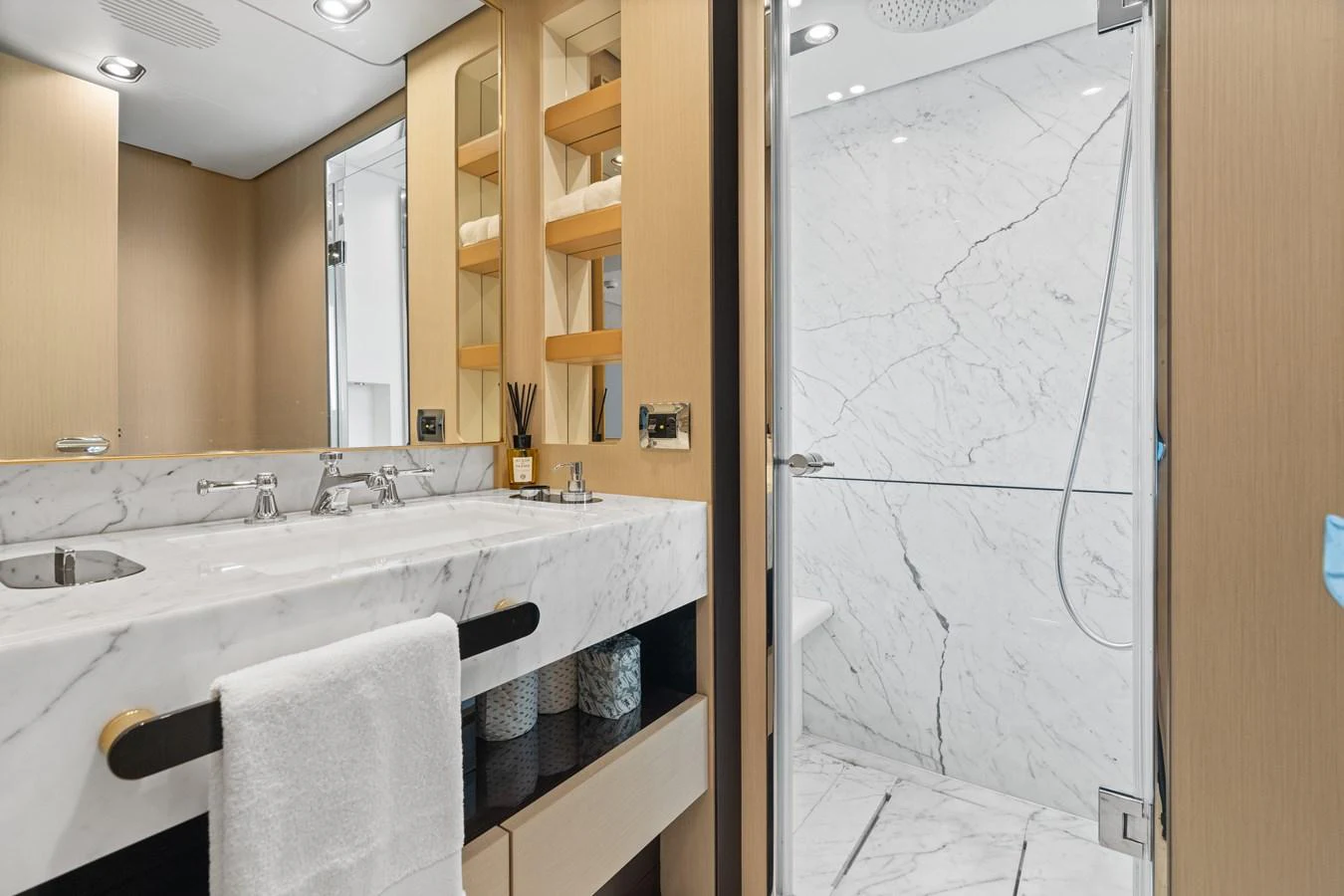 The yacht's bathroom features a luxurious marble sink and shower area with modern fixtures. aboard AZIMUT GRANDE 32/23 Yacht for Sale