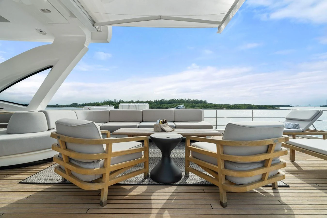 The aft deck offers a spacious and comfortable seating area with a stunning view of the water. aboard AZIMUT GRANDE 32/23 Yacht for Sale
