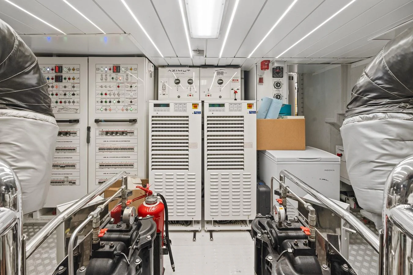 The engine room showcases advanced machinery and control panels, ensuring optimal yacht performance. aboard AZIMUT GRANDE 32/23 Yacht for Sale