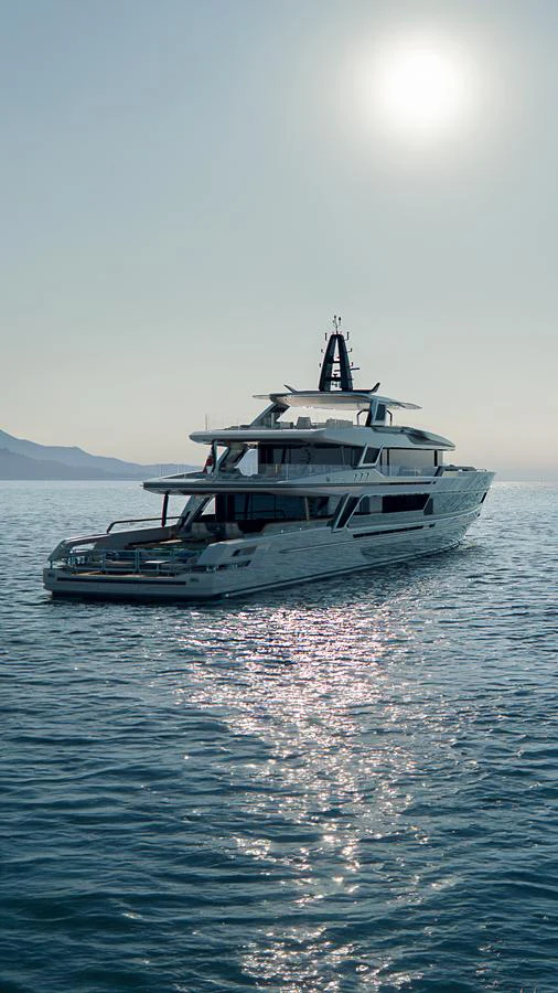 A luxurious yacht cruises gracefully on calm waters under the sun. aboard BAGLIETTO T54 Yacht for Sale