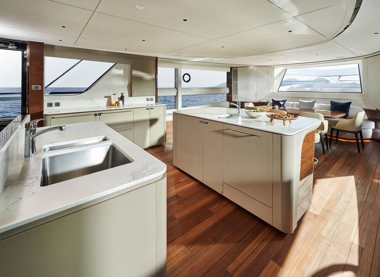 The yacht's galley features modern appliances and ample counter space with a view of the sea. aboard PRINCESS X95 VISTA Yacht for Sale