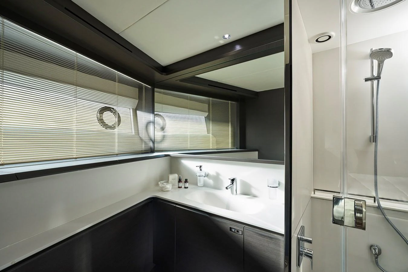 A sleek and modern yacht bathroom with a spacious shower and elegant fixtures. aboard PRINCESS X95 VISTA Yacht for Sale