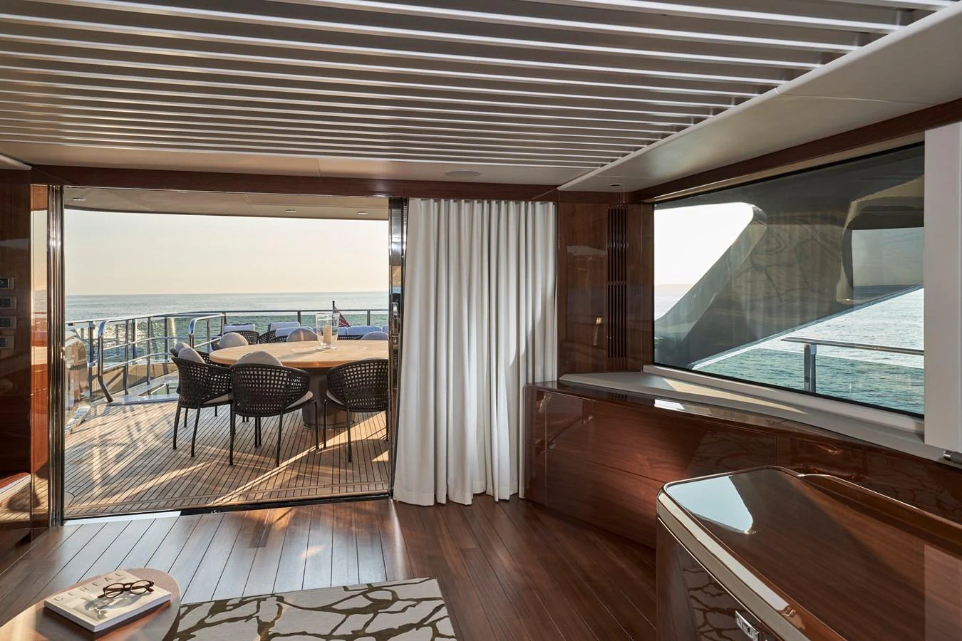 The elegant salon opens up to a spacious deck with stunning ocean views. aboard PRINCESS X95 VISTA Yacht for Sale