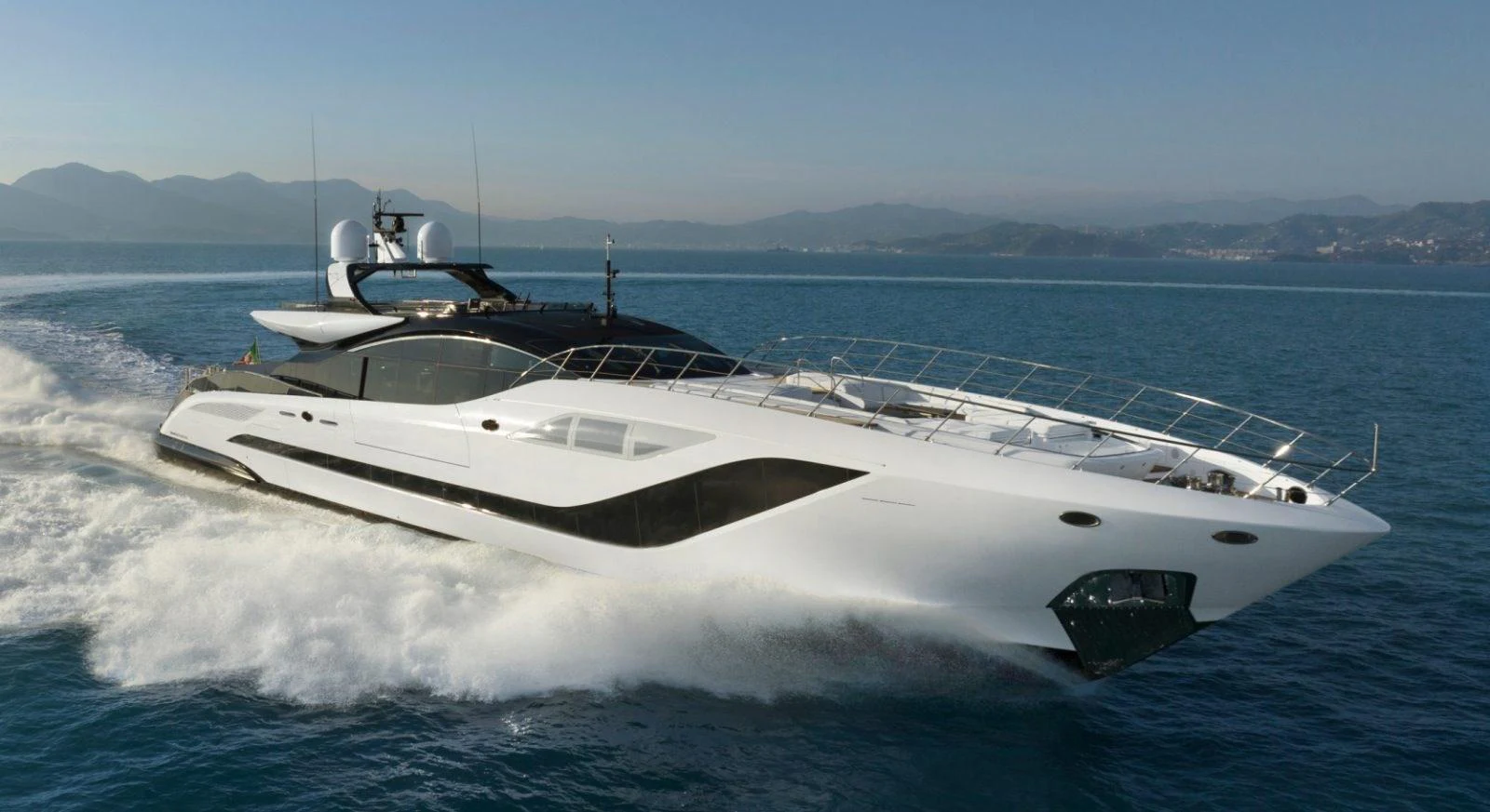 A sleek and modern yacht cruises swiftly through the open water, showcasing its elegant design and powerful performance. aboard REBELLIOUS Yacht for Sale