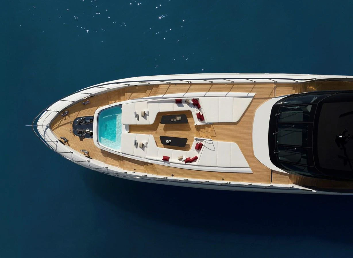 The yacht's sundeck features a luxurious pool and ample lounging space, perfect for relaxation. aboard REBELLIOUS Yacht for Sale