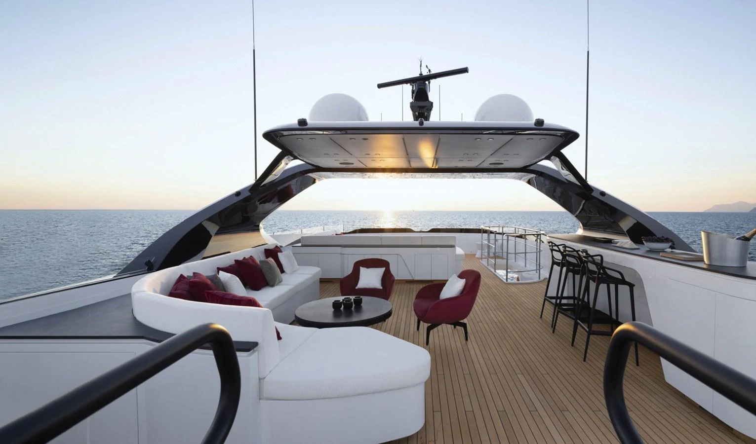 The flybridge offers a luxurious outdoor seating area with panoramic ocean views. aboard REBELLIOUS Yacht for Sale