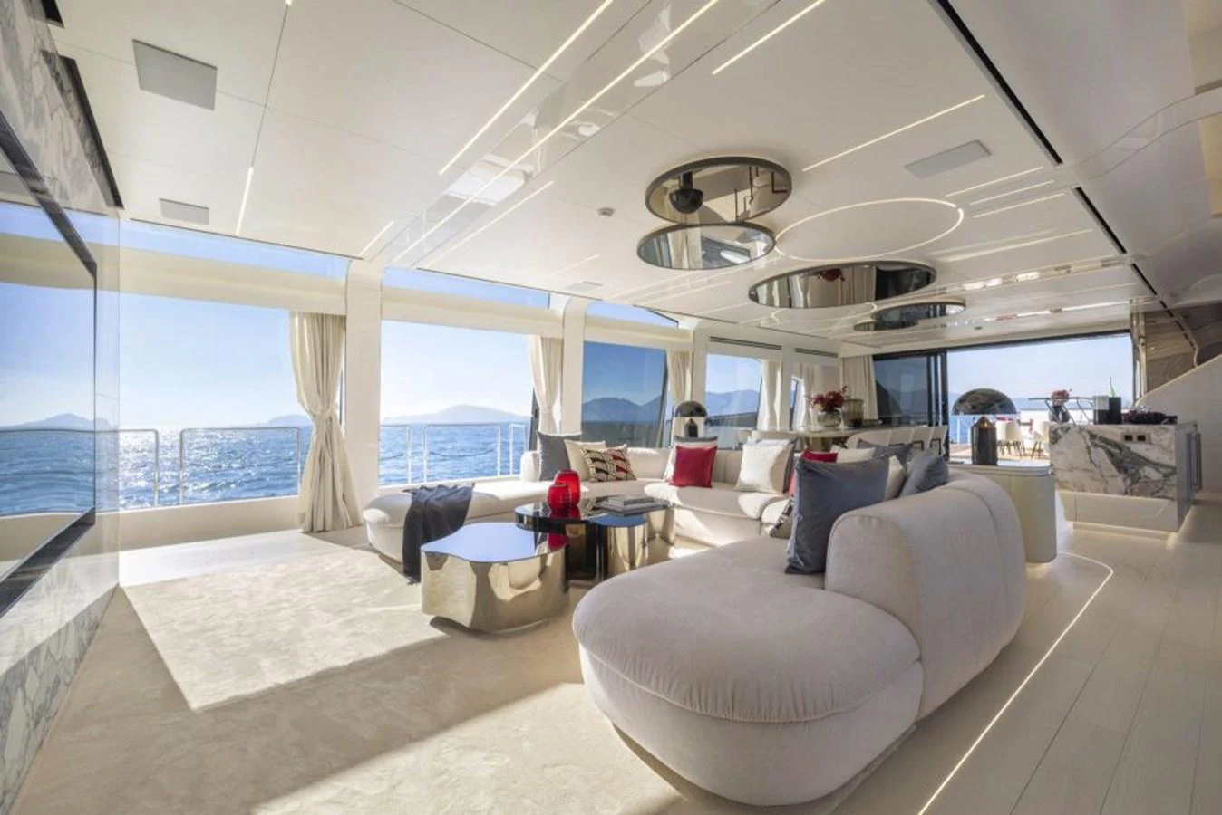 The salon offers a luxurious and spacious area with panoramic ocean views and elegant furnishings. aboard REBELLIOUS Yacht for Sale