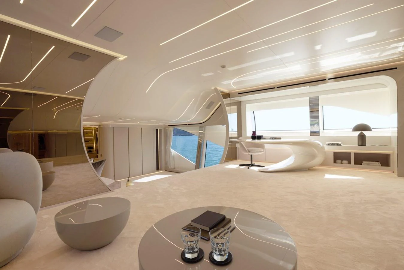 The yacht's interior features a modern, spacious design with sleek furnishings and large windows offering stunning sea views. aboard REBELLIOUS Yacht for Sale