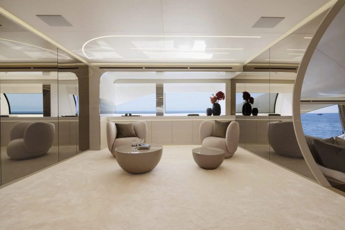 The yacht's interior features a modern and elegant lounge area with plush seating and panoramic windows offering stunning sea views. aboard REBELLIOUS Yacht for Sale
