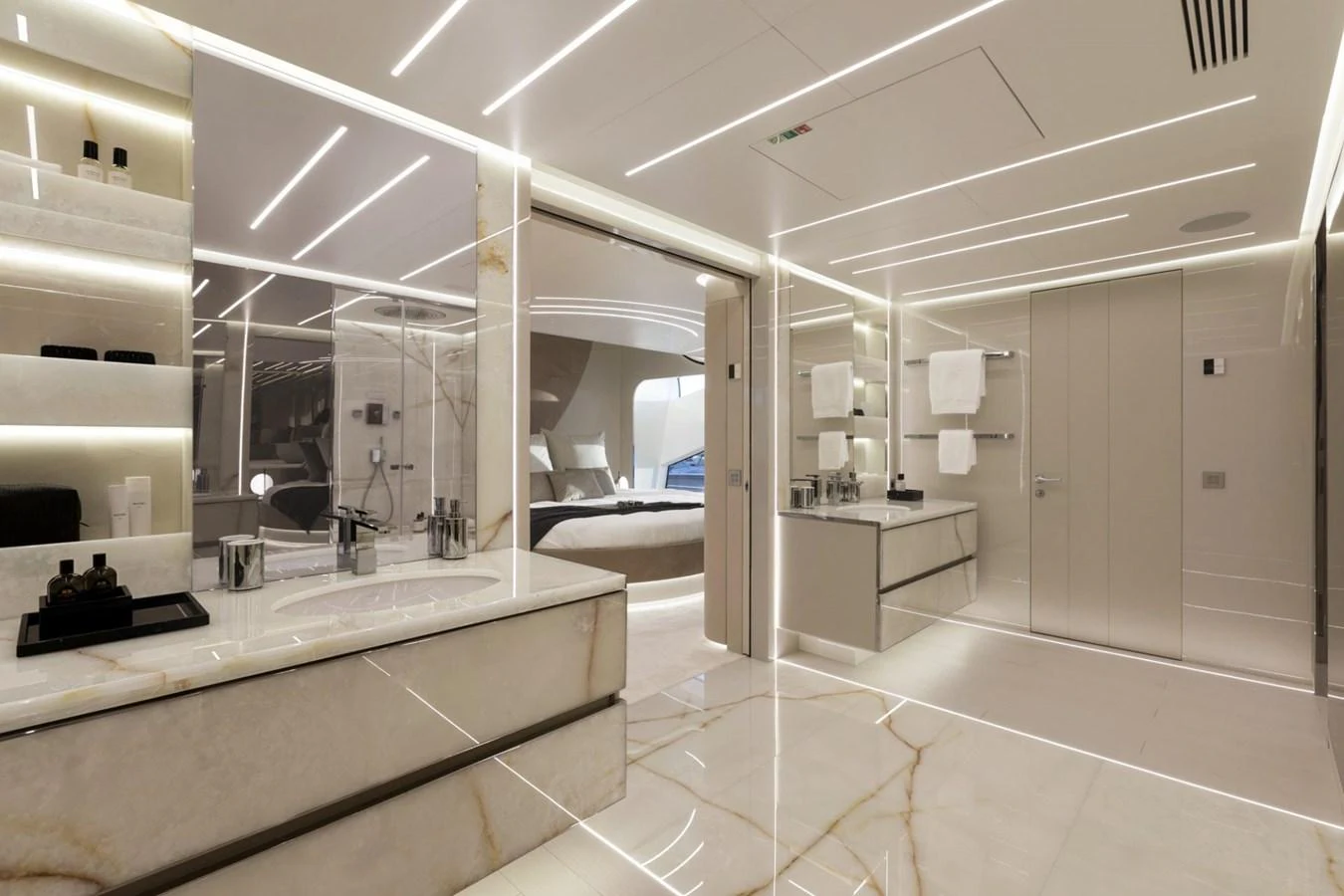 The luxurious bathroom features sleek, modern design with marble accents and ample lighting. aboard REBELLIOUS Yacht for Sale