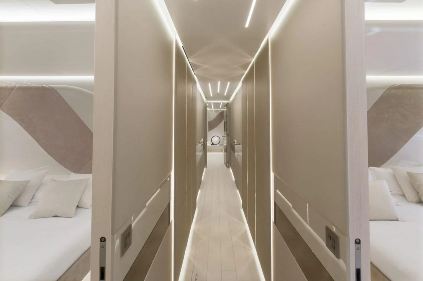 A sleek and modern hallway with ambient lighting leads to the yacht's staterooms. aboard REBELLIOUS Yacht for Sale