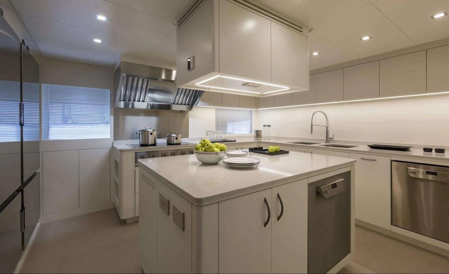 The yacht's galley is equipped with modern appliances and sleek countertops, offering a stylish and functional space for culinary activities. aboard REBELLIOUS Yacht for Sale