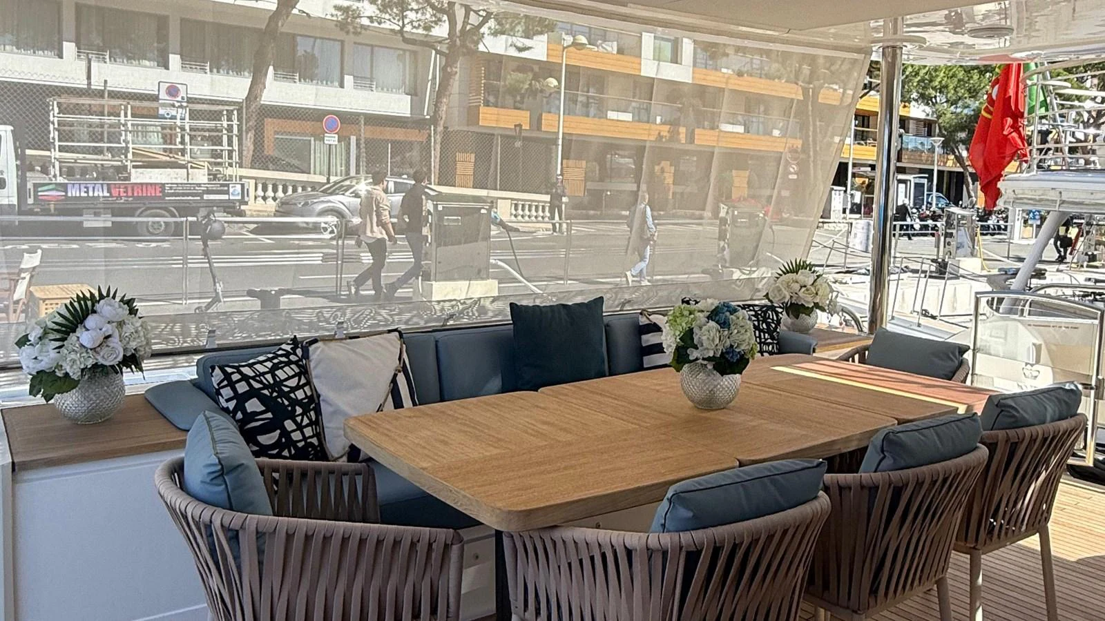 The aft deck features a stylish dining area with comfortable seating and elegant decor. aboard ADROMELIA Yacht for Sale
