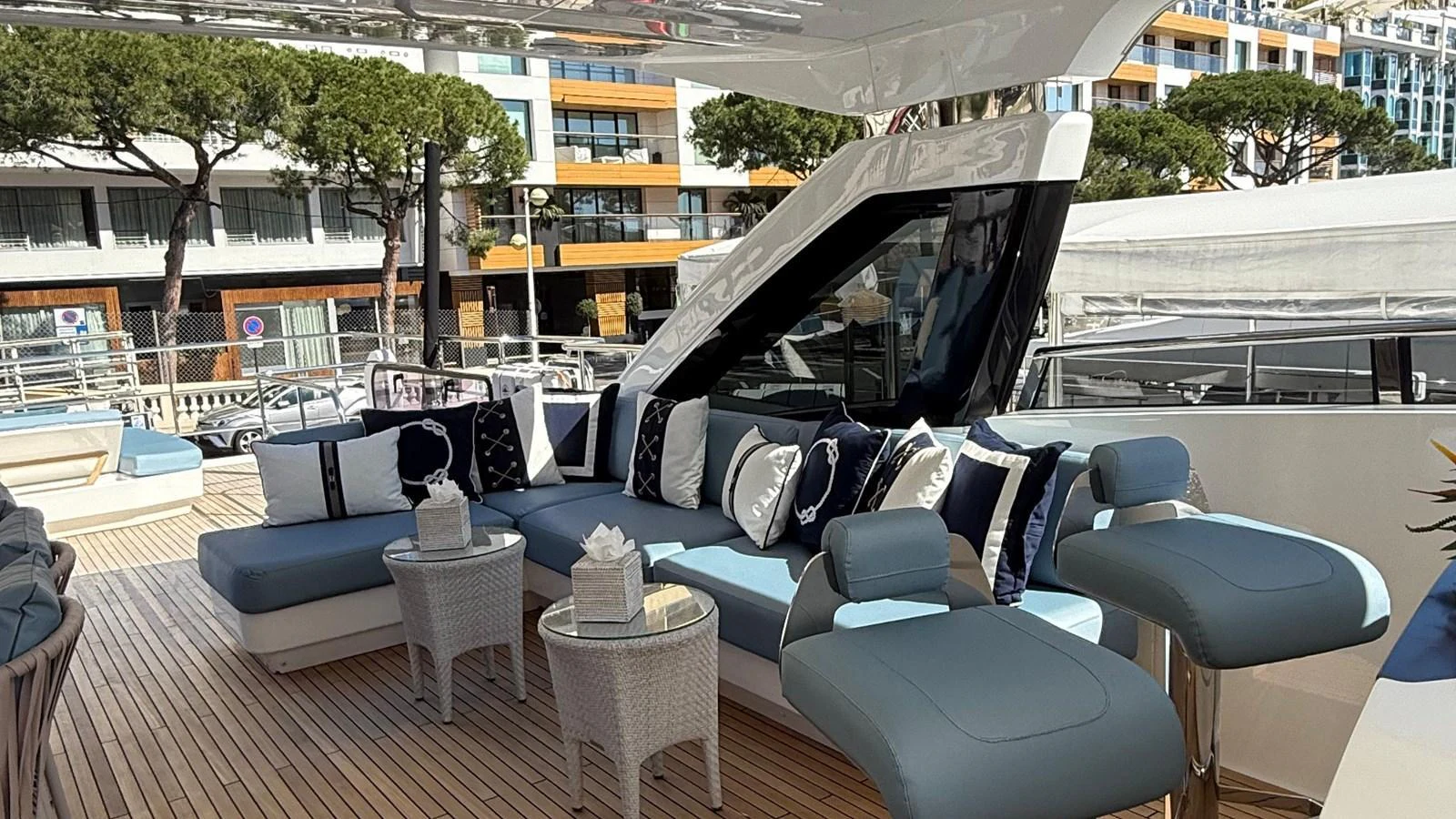 The aft deck features a stylish and comfortable seating area with modern furnishings and elegant decor. aboard ADROMELIA Yacht for Sale