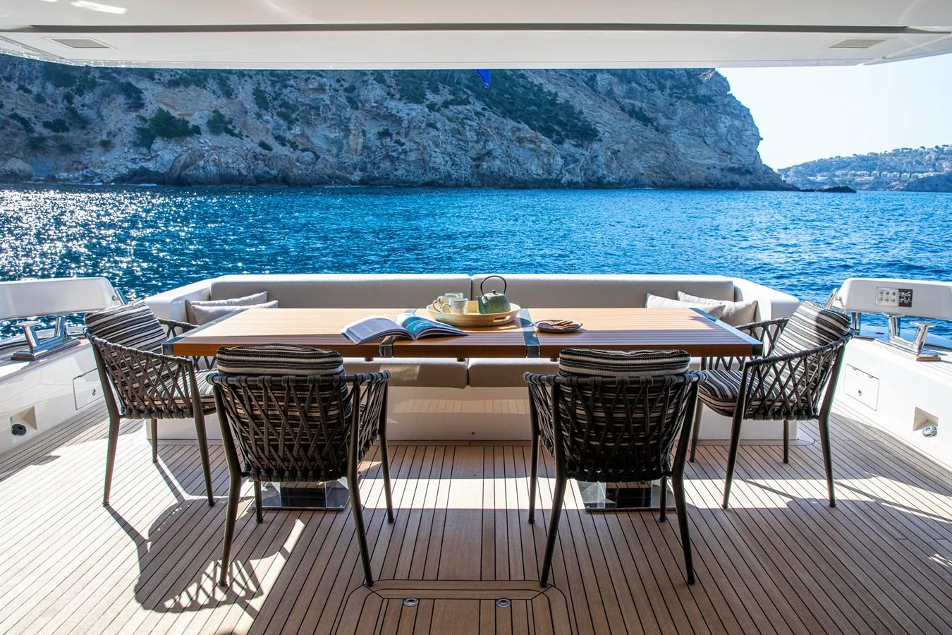 The aft deck offers a serene dining area with stunning ocean views. aboard SEVEN Yacht for Sale