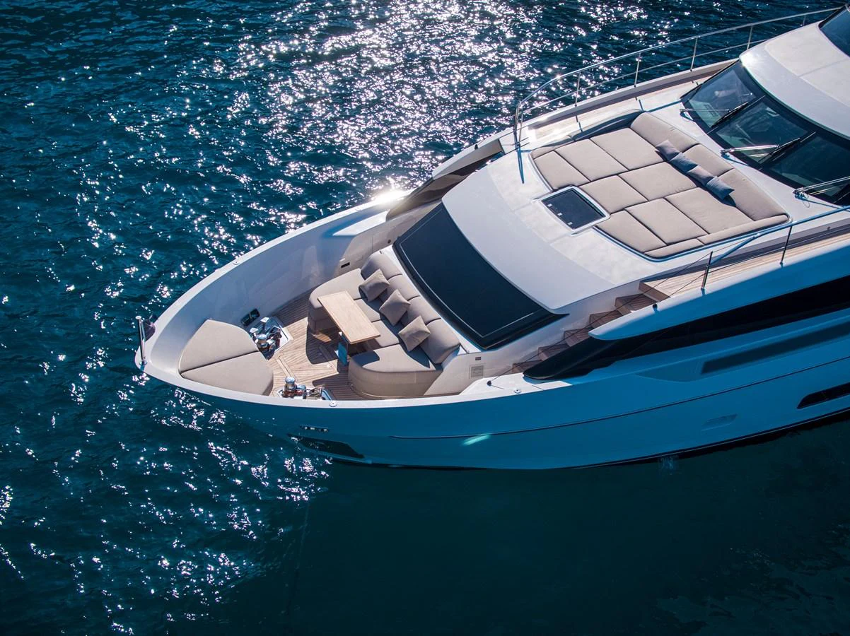 The yacht's foredeck features luxurious sun pads and a comfortable seating area, perfect for relaxation. aboard SEVEN Yacht for Sale