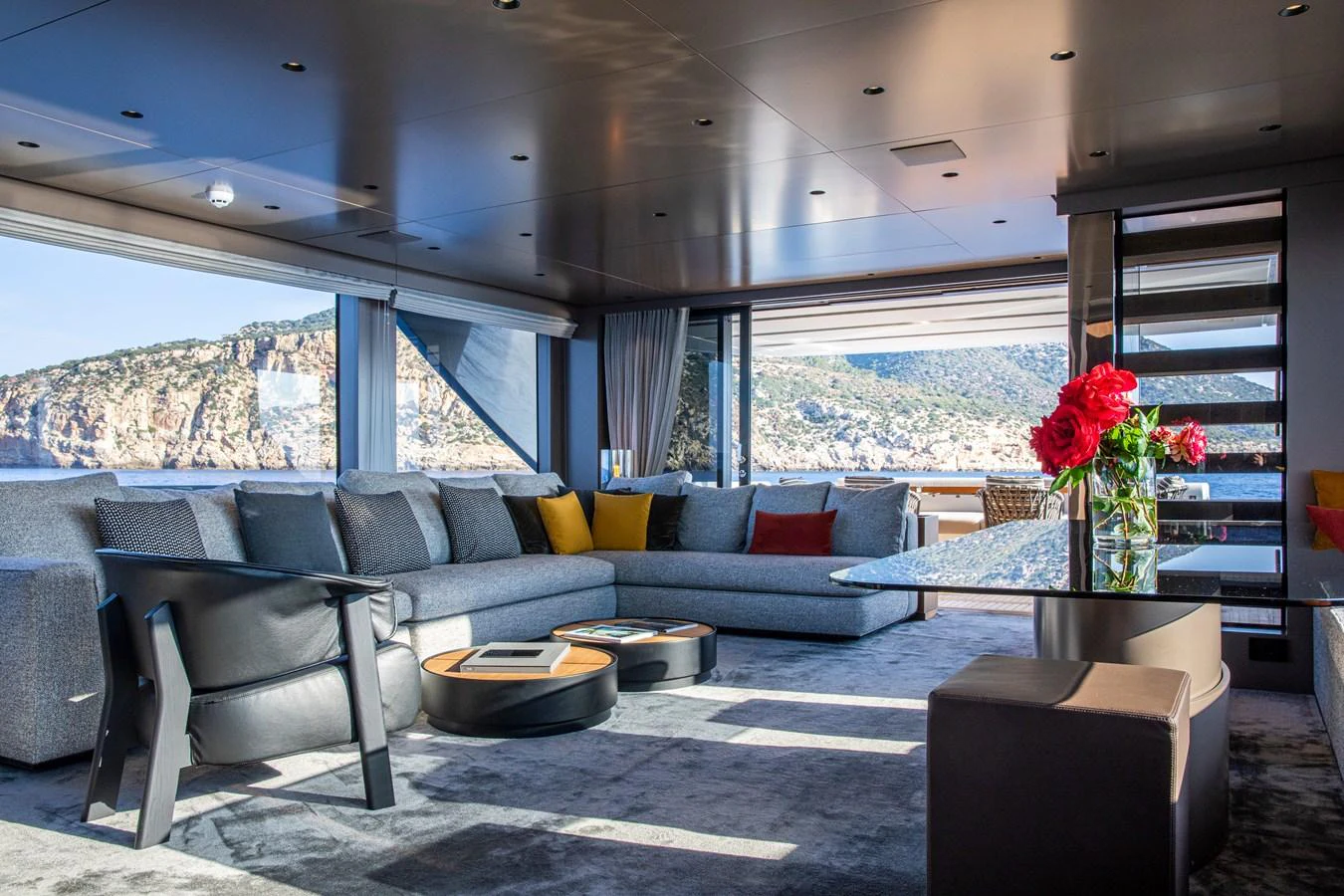 The salon offers a spacious and luxurious seating area with panoramic views. aboard SEVEN Yacht for Sale