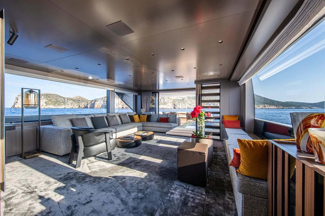 The salon offers a spacious and luxurious seating area with panoramic views of the sea. aboard SEVEN Yacht for Sale