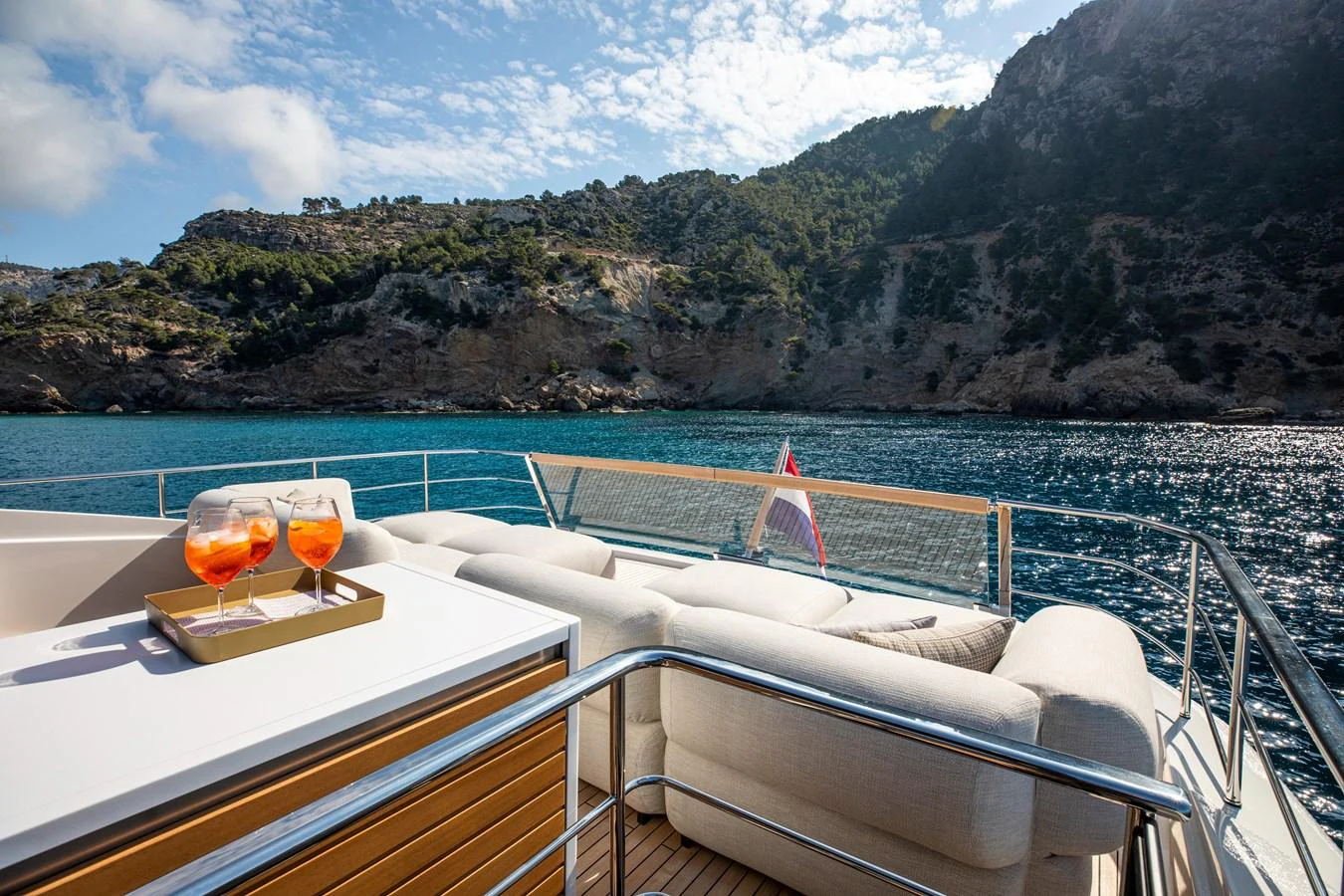 The sundeck offers a luxurious lounging area with stunning views of the surrounding landscape. aboard SEVEN Yacht for Sale