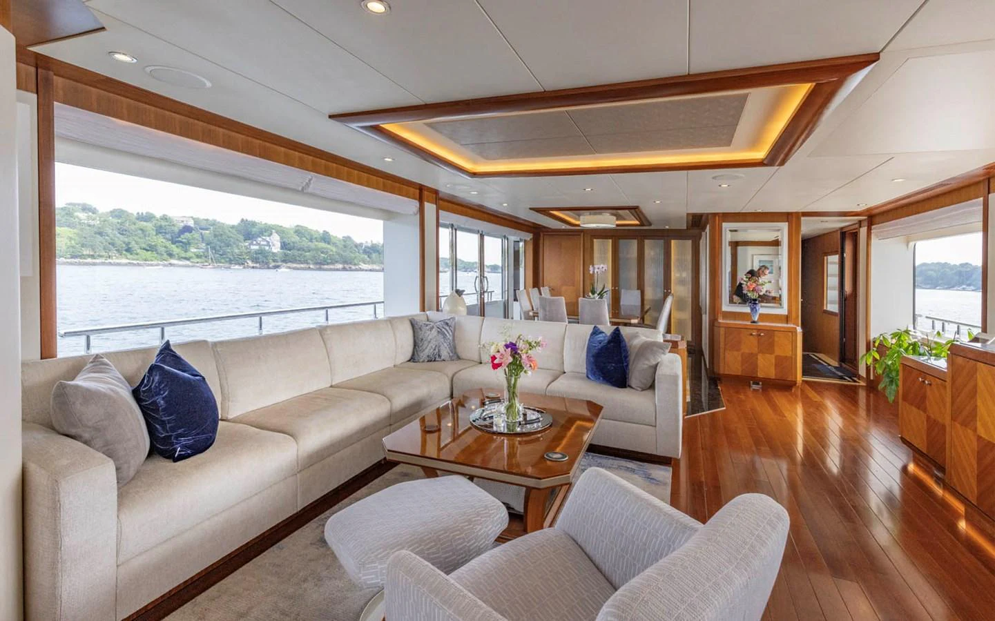 The salon features elegant furnishings with ample seating and panoramic views. aboard WRECKLESS Yacht for Sale