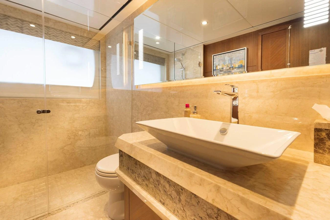The yacht's bathroom features a modern design with elegant fixtures and luxurious materials. aboard WRECKLESS Yacht for Sale