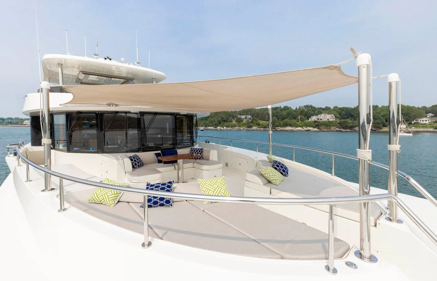The yacht's flybridge features ample seating and a sunshade, perfect for relaxation and enjoying the view. aboard WRECKLESS Yacht for Sale