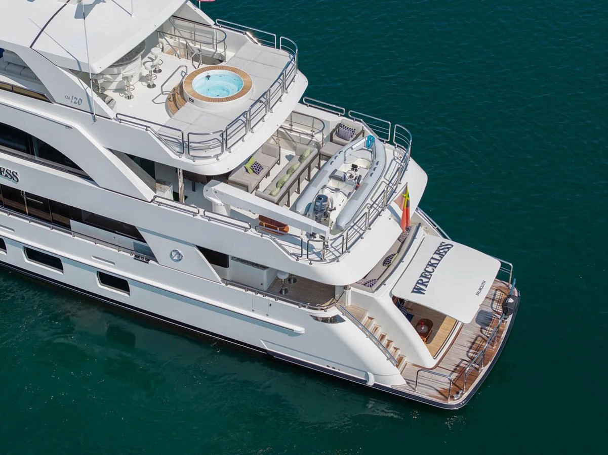 The yacht's aft deck features a luxurious jacuzzi and ample lounging space, perfect for relaxation. aboard WRECKLESS Yacht for Sale