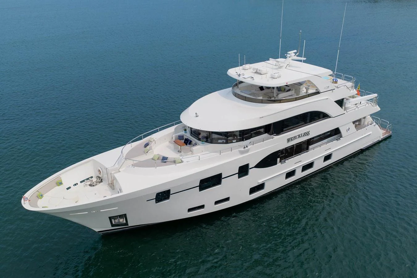 A sleek and modern yacht glides gracefully on calm waters. aboard WRECKLESS Yacht for Sale